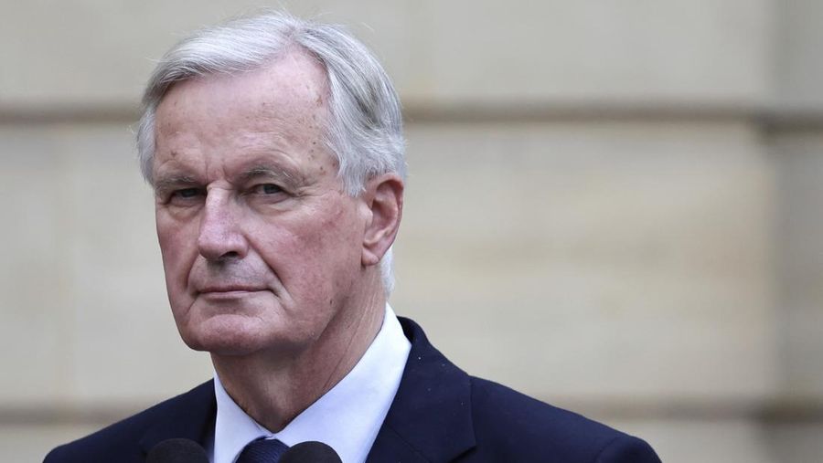 New French prime minister Michel Barnier looks on right during the handover ceremony, Thursday, Sept. 5, 2024 in Paris. President Emmanuel Macron has named EU's Brexit negotiator Michel Barnier as France's new prime minister after more than 50 days of caretaker government. (Stephane de Sakutin/Pool Photo via AP)