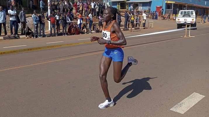 FILE -Rebecca Cheptegei, competes at the Discovery 10km road race in Kapchorwa, Uganda, Jan. 20, 2023. (AP Photo, File)