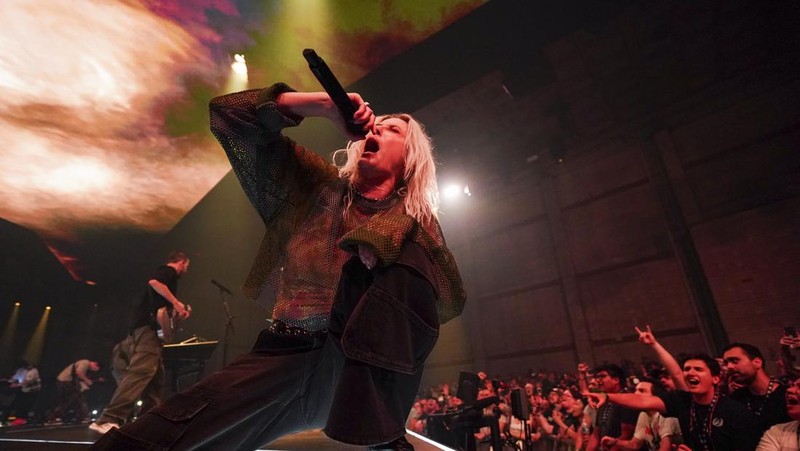 Emily Armstrong, from left, Phoenix, and Alex Feder (filling in for guitarist Brad Delson) of Linkin Park perform Thursday, Sept. 5, 2024, in Los Angeles. It was announced on Thursday that Dead Sara's Emily Armstrong would join as the band's new co-singer and songwriter/producer Colin Brittain would join on drums. Linkin Park will release the album 