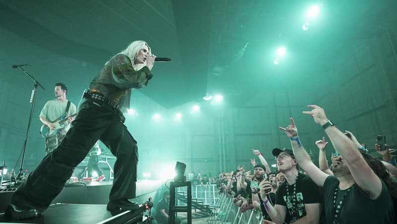 Emily Armstrong, from left, Phoenix, and Alex Feder (filling in for guitarist Brad Delson) of Linkin Park perform Thursday, Sept. 5, 2024, in Los Angeles. It was announced on Thursday that Dead Sara's Emily Armstrong would join as the band's new co-singer and songwriter/producer Colin Brittain would join on drums. Linkin Park will release the album 