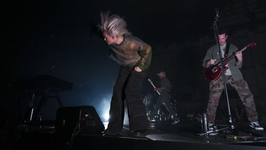 Emily Armstrong, from left, Phoenix, and Alex Feder (filling in for guitarist Brad Delson) of Linkin Park perform Thursday, Sept. 5, 2024, in Los Angeles. It was announced on Thursday that Dead Sara's Emily Armstrong would join as the band's new co-singer and songwriter/producer Colin Brittain would join on drums. Linkin Park will release the album