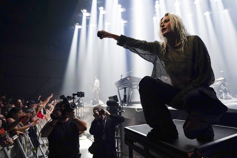 Emily Armstrong, from left, Phoenix, and Alex Feder (filling in for guitarist Brad Delson) of Linkin Park perform Thursday, Sept. 5, 2024, in Los Angeles. It was announced on Thursday that Dead Sara's Emily Armstrong would join as the band's new co-singer and songwriter/producer Colin Brittain would join on drums. Linkin Park will release the album 
