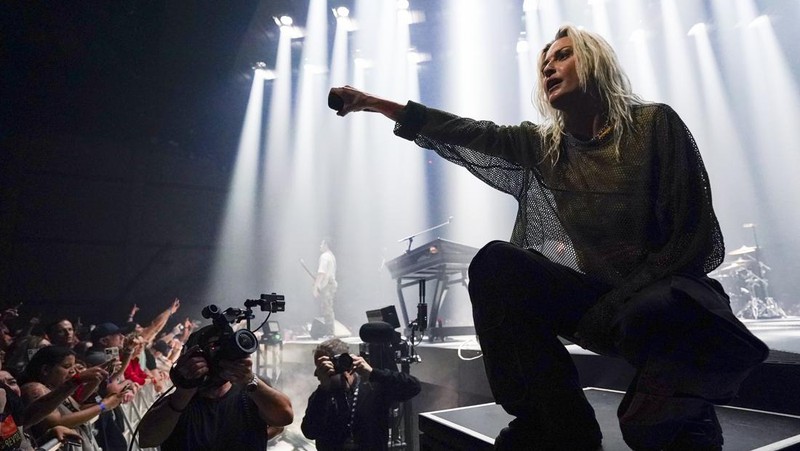 Emily Armstrong, from left, Phoenix, and Alex Feder (filling in for guitarist Brad Delson) of Linkin Park perform Thursday, Sept. 5, 2024, in Los Angeles. It was announced on Thursday that Dead Sara's Emily Armstrong would join as the band's new co-singer and songwriter/producer Colin Brittain would join on drums. Linkin Park will release the album 