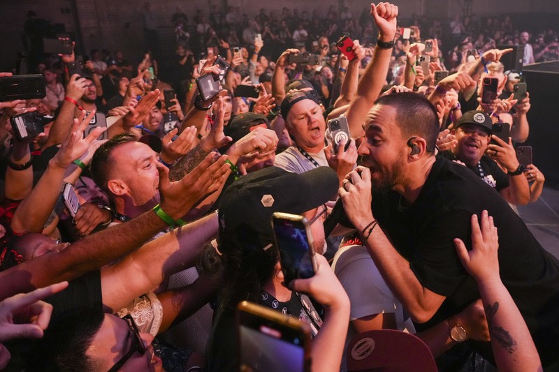 Emily Armstrong, from left, Phoenix, and Alex Feder (filling in for guitarist Brad Delson) of Linkin Park perform Thursday, Sept. 5, 2024, in Los Angeles. It was announced on Thursday that Dead Sara's Emily Armstrong would join as the band's new co-singer and songwriter/producer Colin Brittain would join on drums. Linkin Park will release the album 