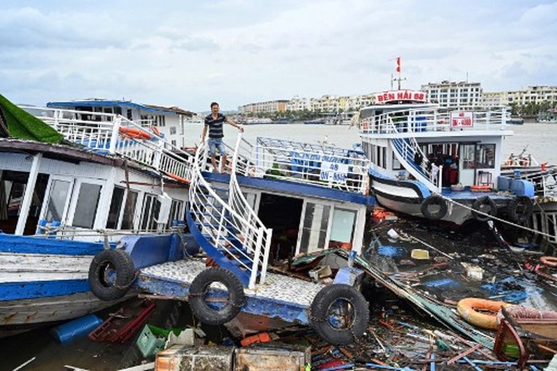 This aerial picture shows damaged buildings and debris on a street after Super Typhoon Yagi hit Ha Long, in Quang Ninh province, on September 8, 2024. Super Typhoon Yagi uproots thousands of trees, sweeps ships and boats out to sea and rips roofs off houses in northern Vietnam, after leaving a trail of destruction in southern China and the Philippines. (Photo by NHAC NGUYEN / AFP)