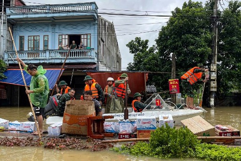 VIETNAM-CHINA-WEATHER-STORM-CLIMATE This aerial picture shows damaged buildings and debris on a street after Super Typhoon Yagi hit Ha Long, in Quang Ninh province, on September 8, 2024. Super Typhoon Yagi uproots thousands of trees, sweeps ships and boats out to sea and rips roofs off houses in northern Vietnam, after leaving a trail of destruction in southern China and the Philippines. (Photo by NHAC NGUYEN / AFP)