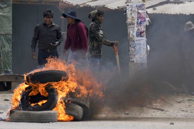 A supporter of former President Evo Morales clashes with supporters of current President Luis Arce in El Alto, Bolivia, Sunday, Sept. 22, 2024. (AP Photo/Juan Karita)
