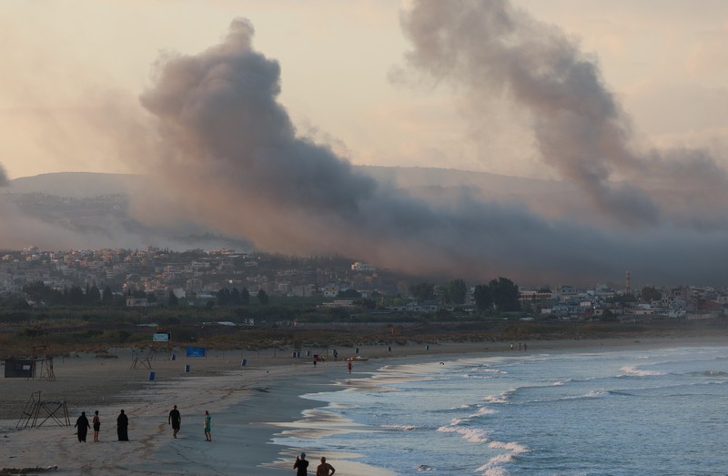 ISRAEL-PALESTINIANS/LEBANON Smoke billows over southern Lebanon following Israeli strikes, amid ongoing cross-border hostilities between Hezbollah and Israeli forces, as seen from Tyre, southern Lebanon September 23, 2024. REUTERS/Aziz Taher