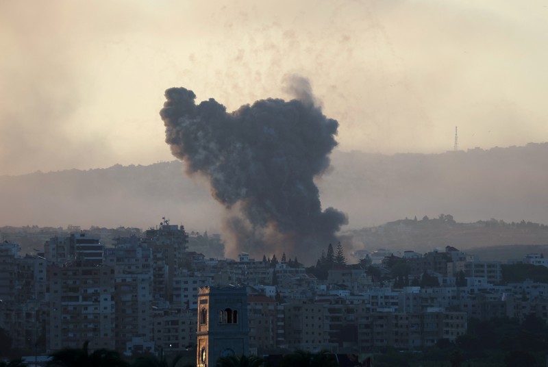 ISRAEL-PALESTINIANS/LEBANON Smoke billows over southern Lebanon following Israeli strikes, amid ongoing cross-border hostilities between Hezbollah and Israeli forces, as seen from Tyre, southern Lebanon September 23, 2024. REUTERS/Aziz Taher