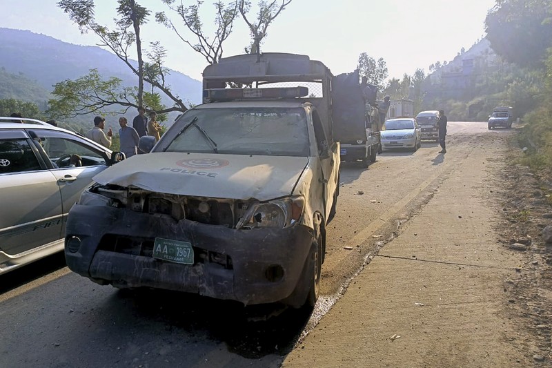 PAKISTAN-UNREST-DIPLOMACY-NORTHWEST Security personnel examine the site of a bomb explosion, at Malam Jabba in the Swat district of Khyber Pakhtunkhwa province on September 22, 2024. A Pakistan policeman was killed and three others injured after a roadside bomb hit a convoy of foreign diplomats in the northwest, police said on September 22. (Photo by Mehboob UL HAQ / AFP)