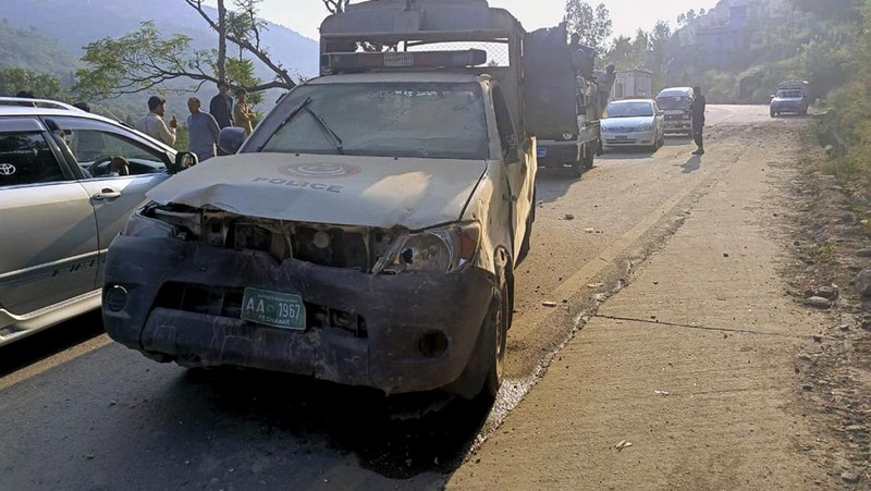 Security personnel examine the site of a bomb explosion, at Malam Jabba in the Swat district of Khyber Pakhtunkhwa province on September 22, 2024. A Pakistan policeman was killed and three others injured after a roadside bomb hit a convoy of foreign diplomats in the northwest, police said on September 22. (Photo by Mehboob UL HAQ / AFP)