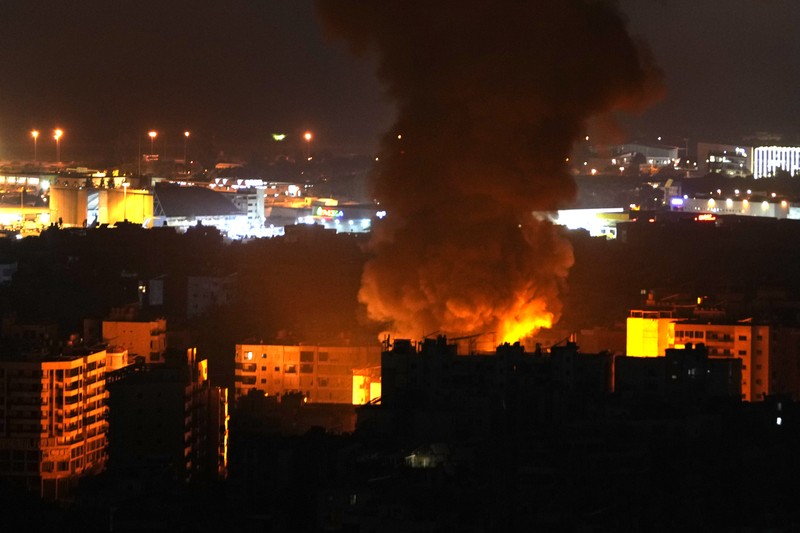 Lebanon Israel Flames and smoke rise from an Israeli airstrike in Dahiyeh, Beirut, Lebanon, early Sunday, Oct. 6, 2024. (AP Photo/Hussein Malla)