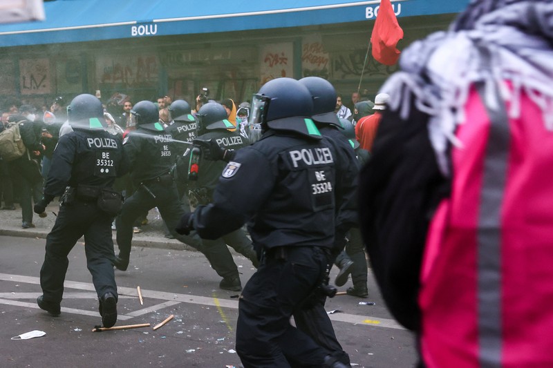 ISRAEL-PALESTINIANS/ANNIVERSARY GERMANY PROTEST A flare is thrown at police during a demonstration in support of Palestinians in Gaza, one day ahead of the anniversary of Hamas' October 7 attack on Israel, in Berlin, Germany, October 6, 2024. REUTERS/Christian Mang