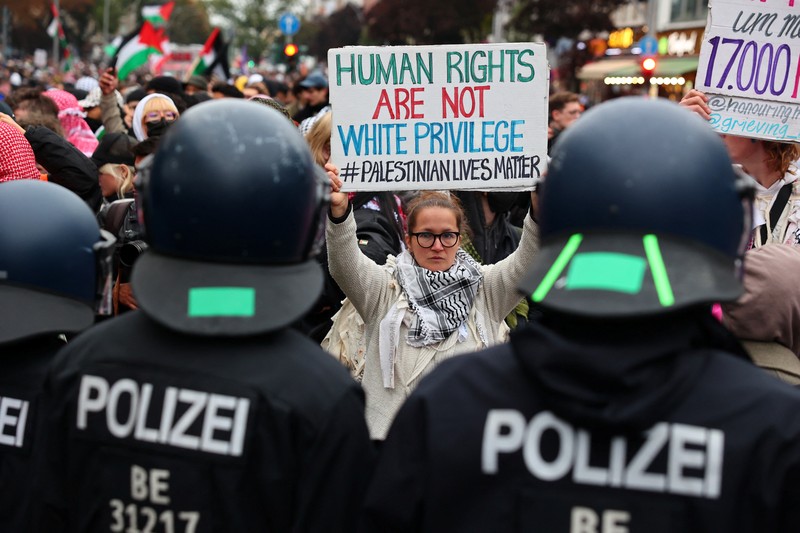 A flare is thrown at police during a demonstration in support of Palestinians in Gaza, one day ahead of the anniversary of Hamas' October 7 attack on Israel, in Berlin, Germany, October 6, 2024. REUTERS/Christian Mang