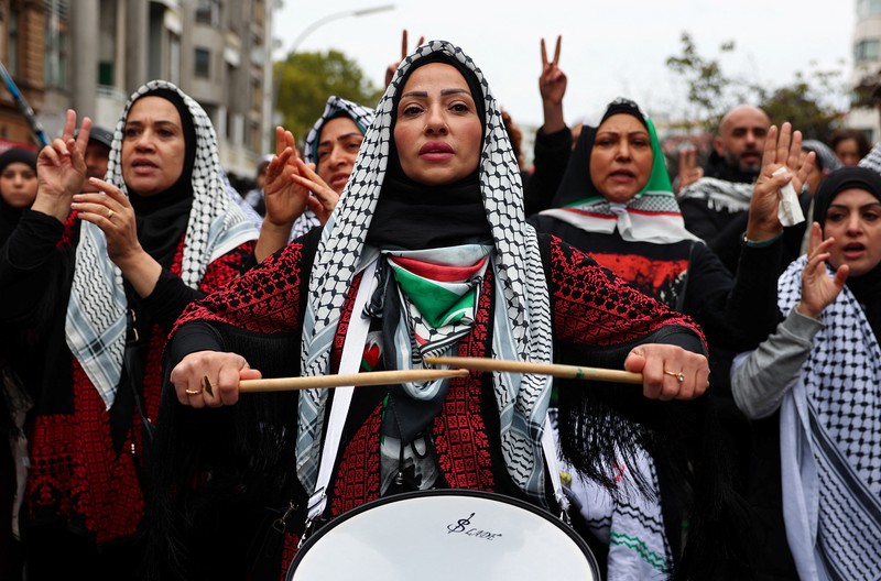 ISRAEL-PALESTINIANS/ANNIVERSARY GERMANY PROTEST A flare is thrown at police during a demonstration in support of Palestinians in Gaza, one day ahead of the anniversary of Hamas' October 7 attack on Israel, in Berlin, Germany, October 6, 2024. REUTERS/Christian Mang