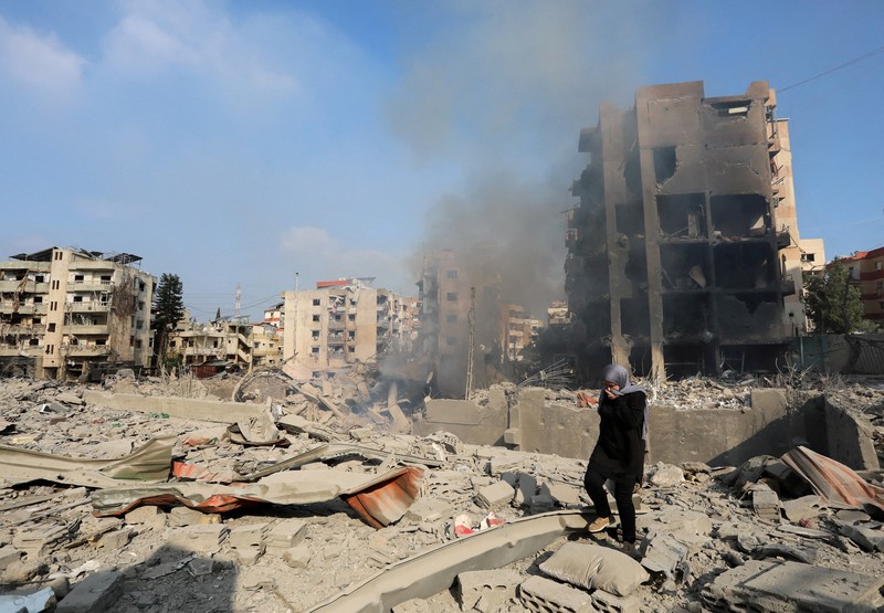 ISRAEL-PALESTINIANS/LEBANON A man walks on the rubble of a damaged site, in the aftermath of Israeli strikes on Beirut's southern suburbs, amid the ongoing hostilities between Hezbollah and Israeli forces, Lebanon, October 6, 2024. REUTERS/Stringer