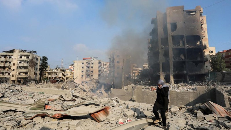 A man walks on the rubble of a damaged site, in the aftermath of Israeli strikes on Beirut's southern suburbs, amid the ongoing hostilities between Hezbollah and Israeli forces, Lebanon, October 6, 2024. REUTERS/Stringer