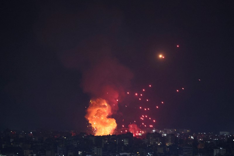 Lebanon Israel Flames and smoke rise from an Israeli airstrike in Dahiyeh, Beirut, Lebanon, early Sunday, Oct. 6, 2024. (AP Photo/Hussein Malla)