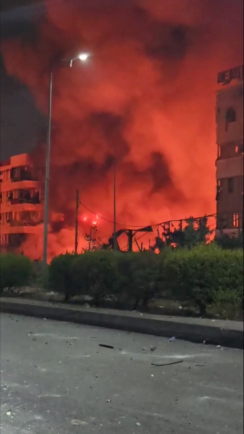 Lebanon Israel Flames and smoke rise from an Israeli airstrike in Dahiyeh, Beirut, Lebanon, early Sunday, Oct. 6, 2024. (AP Photo/Hussein Malla)