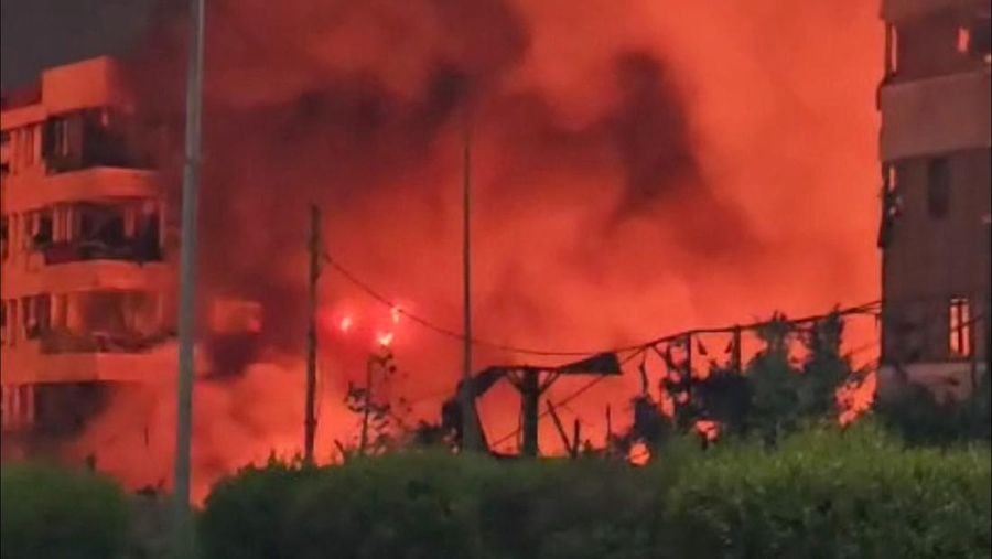 Smoke and flames rise near the hotel Beirut Golden Plaza, following an airstrike amid ongoing hostilities between Hezbollah and Israeli forces, in Beirut, Lebanon October 5, 2024, in this screengrab obtained from a social media video. SOCIAL MEDIA/via REUTERS THIS IMAGE HAS BEEN SUPPLIED BY A THIRD PARTY. NO RESALES. NO ARCHIVES.