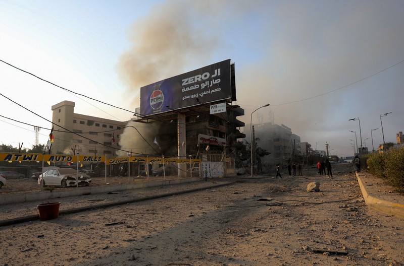 A man walks on the rubble of a damaged site, in the aftermath of Israeli strikes on Beirut's southern suburbs, amid the ongoing hostilities between Hezbollah and Israeli forces, Lebanon, October 6, 2024. REUTERS/Stringer