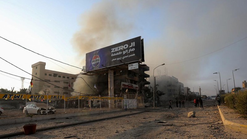 A man walks on the rubble of a damaged site, in the aftermath of Israeli strikes on Beirut's southern suburbs, amid the ongoing hostilities between Hezbollah and Israeli forces, Lebanon, October 6, 2024. REUTERS/Stringer