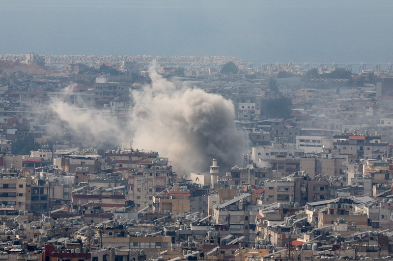 ISRAEL-PALESTINIANS/LEBANON A man walks on the rubble of a damaged site, in the aftermath of Israeli strikes on Beirut's southern suburbs, amid the ongoing hostilities between Hezbollah and Israeli forces, Lebanon, October 6, 2024. REUTERS/Stringer