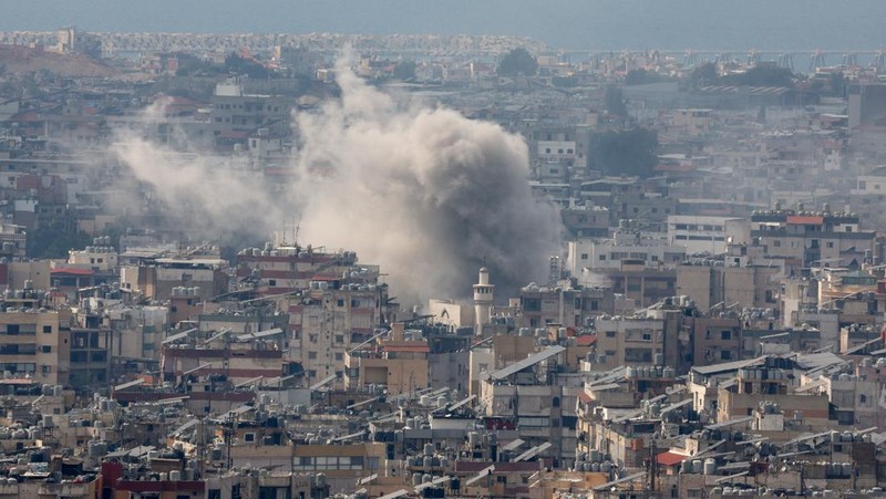 A man walks on the rubble of a damaged site, in the aftermath of Israeli strikes on Beirut's southern suburbs, amid the ongoing hostilities between Hezbollah and Israeli forces, Lebanon, October 6, 2024. REUTERS/Stringer