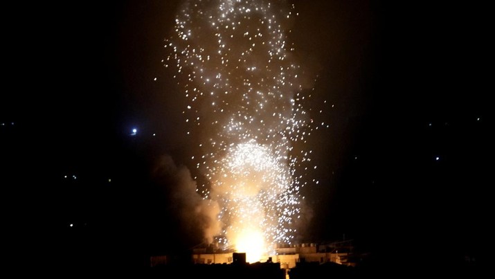 Flames and smoke rise from an Israeli airstrike in Dahiyeh, Beirut, Lebanon, early Sunday, Oct. 6, 2024. (AP Photo/Hussein Malla)