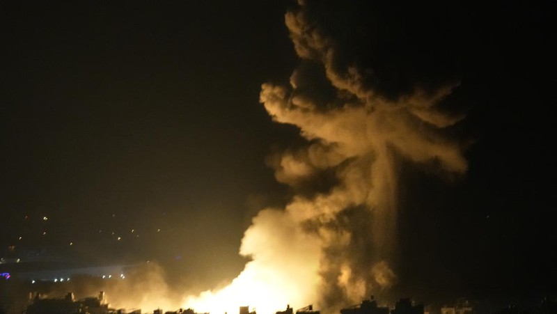 Flames and smoke rise from an Israeli airstrike in Dahiyeh, Beirut, Lebanon, early Sunday, Oct. 6, 2024. (AP Photo/Hussein Malla)