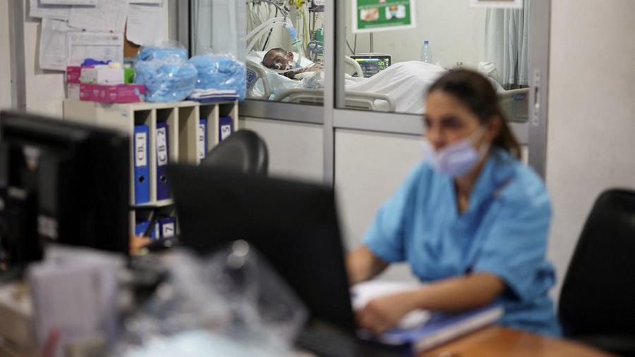 Medical staff members attend to a patient, casualty of an airstrike, in the ICU of Geitaoui Hospital burns unit, in Beirut, Lebanon, October 8, 2024. REUTERS/Louisa Gouliamaki