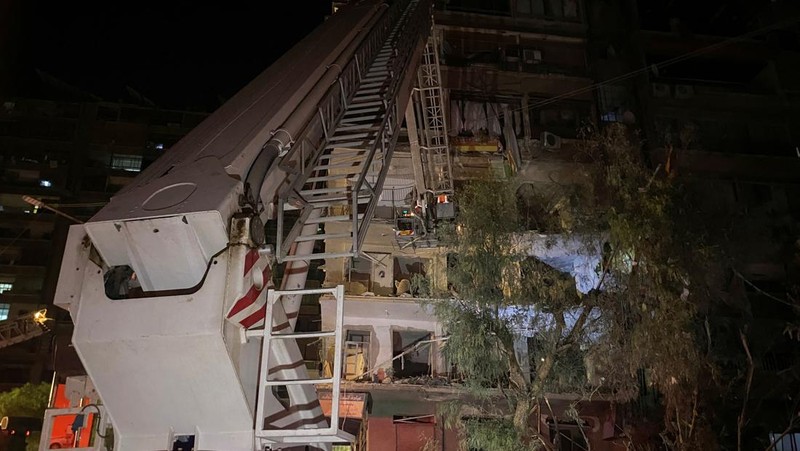 Rescuers work at the site of an Israeli airstrike that targeted a residential building in the Mezzah suburb west of the Syrian capital Damascus, Syria's state news agency reported, Syria October 8, 2024. REUTERS/Firas Makdesi REFILE - QUALITY REPEAT