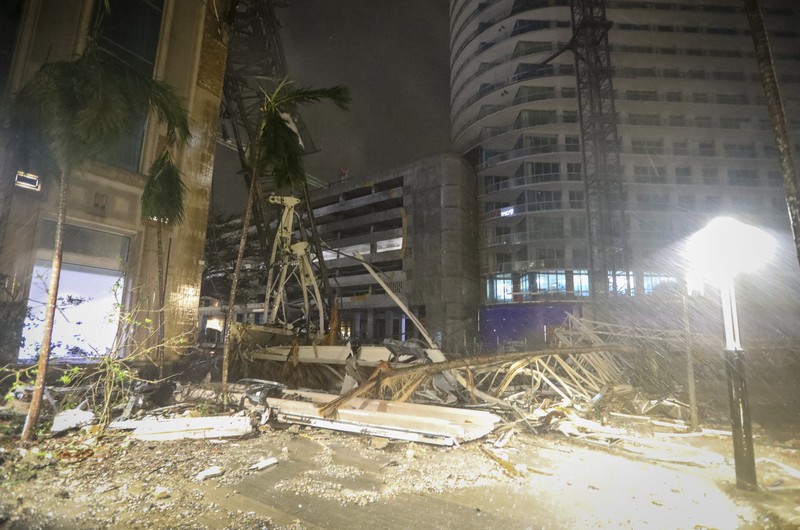 Debris is strewn on a street following the collapse of a crane, during heavy rainfall and strong winds caused by Hurricane Milton, in St. Petersburg, Florida, U.S., October 9, 2024, in this screengrab taken from a social media video. Mike's Weather Page/via REUTERS  THIS IMAGE HAS BEEN SUPPLIED BY A THIRD PARTY. MANDATORY CREDIT. NO RESALES. NO ARCHIVES. DO NOT OBSCURE LOGO.
