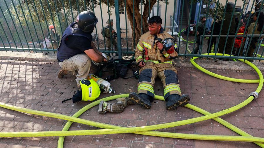 A man stands inside a residential apartment building that was damaged by a rocket fired from Lebanon, amid hostilities between Hezbollah and Israel, in Kiryat Yam, northern Israel, October 8, 2024. REUTERS/Shir Torem     TPX IMAGES OF THE DAY