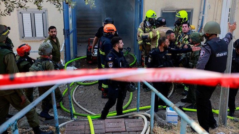 A man stands inside a residential apartment building that was damaged by a rocket fired from Lebanon, amid hostilities between Hezbollah and Israel, in Kiryat Yam, northern Israel, October 8, 2024. REUTERS/Shir Torem     TPX IMAGES OF THE DAY