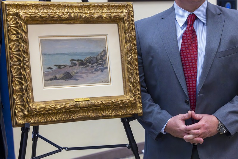 Francoise Parlagi, center, and Helen Lowe, far left, descendants of the original owners the Claude Monet painting entitled 