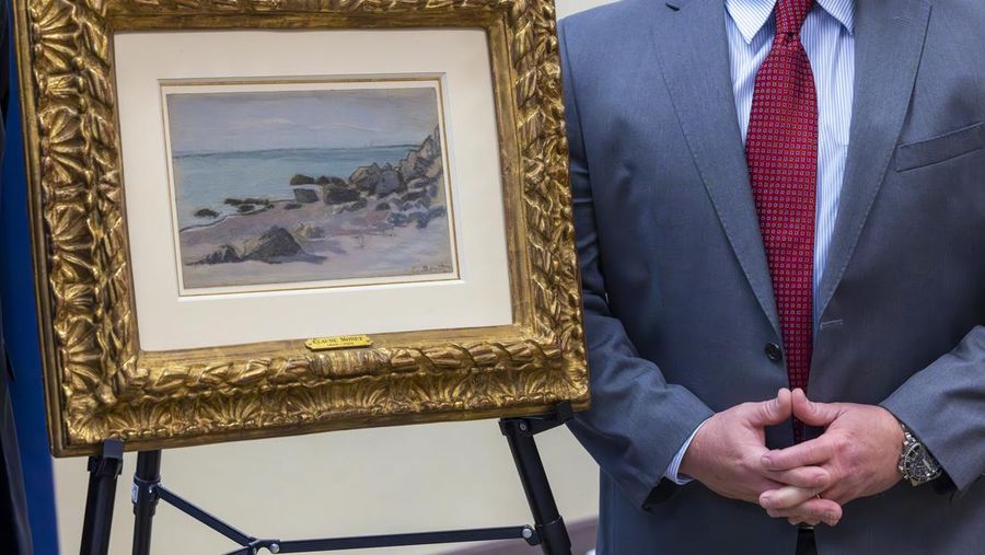 Francoise Parlagi, center, and Helen Lowe, far left, descendants of the original owners the Claude Monet painting entitled 