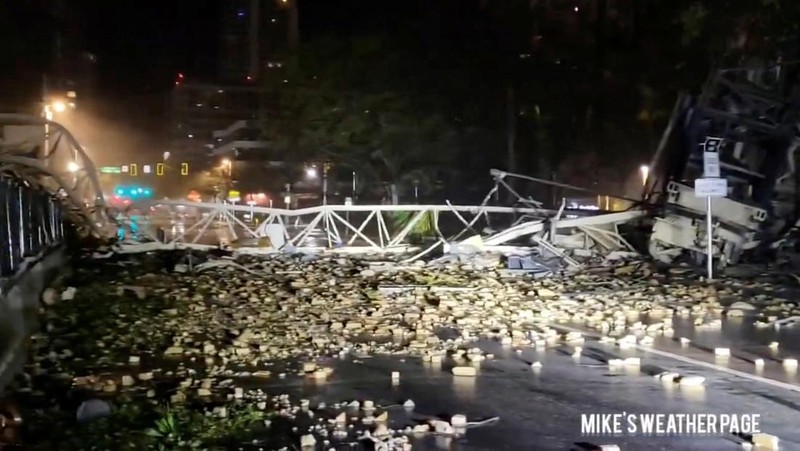 Debris is strewn on a street following the collapse of a crane, during heavy rainfall and strong winds caused by Hurricane Milton, in St. Petersburg, Florida, U.S., October 9, 2024, in this screengrab taken from a social media video. Mike's Weather Page/via REUTERS  THIS IMAGE HAS BEEN SUPPLIED BY A THIRD PARTY. MANDATORY CREDIT. NO RESALES. NO ARCHIVES. DO NOT OBSCURE LOGO.