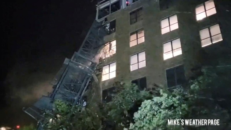 Debris is strewn on a street following the collapse of a crane, during heavy rainfall and strong winds caused by Hurricane Milton, in St. Petersburg, Florida, U.S., October 9, 2024, in this screengrab taken from a social media video. Mike's Weather Page/via REUTERS  THIS IMAGE HAS BEEN SUPPLIED BY A THIRD PARTY. MANDATORY CREDIT. NO RESALES. NO ARCHIVES. DO NOT OBSCURE LOGO.