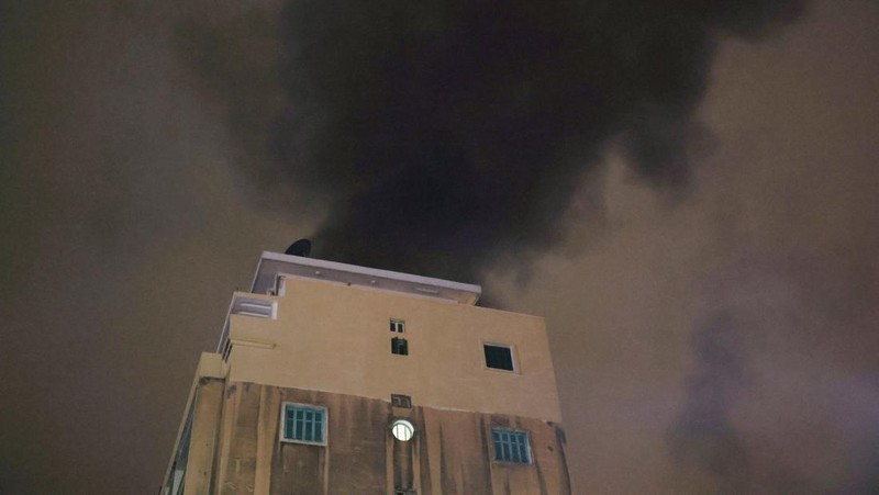 A building stands on the street while smoke raises, after an Israeli air strike, amid ongoing hostilities between Hezbollah and Israeli forces, in Beirut, Lebanon, October 10, 2024. REUTERS/Louisa Gouliamaki