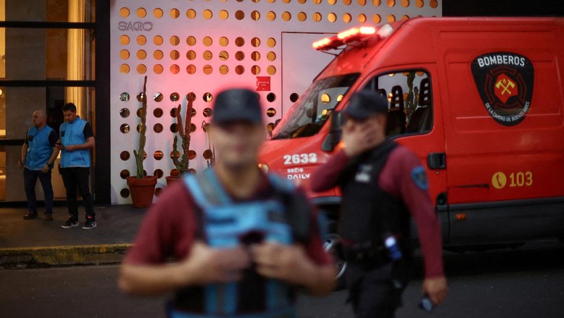 First responders work outside the hotel where Liam Payne, former One Direction member, was found dead, in Buenos Aires, Argentina, October 16, 2024. REUTERS/Agustin Marcarian