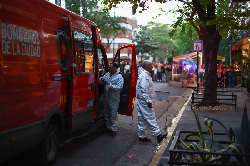 First responders work outside the hotel where Liam Payne, former One Direction member, was found dead, in Buenos Aires, Argentina, October 16, 2024. REUTERS/Agustin Marcarian