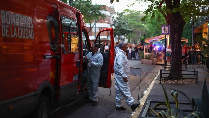 First responders work outside the hotel where Liam Payne, former One Direction member, was found dead, in Buenos Aires, Argentina, October 16, 2024. REUTERS/Agustin Marcarian