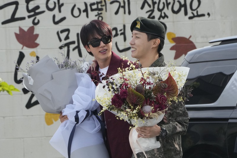 K-pop band BTS's member J-Hope reacts after being discharged from a mandatory military service outside of an army base in Wonju, South Korea, Thursday, Oct. 17, 2024. (AP Photo/Ahn Young-joon)