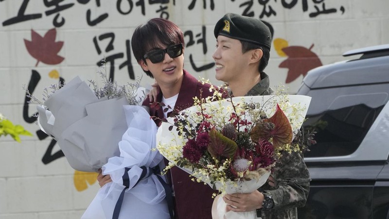 K-pop band BTS's member J-Hope reacts after being discharged from a mandatory military service outside of an army base in Wonju, South Korea, Thursday, Oct. 17, 2024. (AP Photo/Ahn Young-joon)