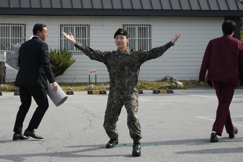 K-pop band BTS's member J-Hope reacts after being discharged from a mandatory military service outside of an army base in Wonju, South Korea, Thursday, Oct. 17, 2024. (AP Photo/Ahn Young-joon)