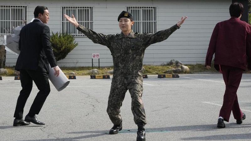 K-pop band BTS's member J-Hope reacts after being discharged from a mandatory military service outside of an army base in Wonju, South Korea, Thursday, Oct. 17, 2024. (AP Photo/Ahn Young-joon)