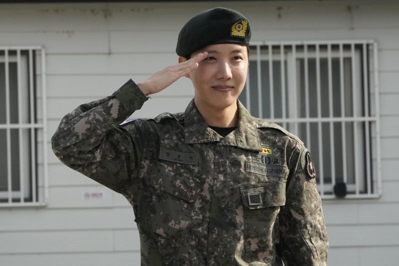 K-pop band BTS's member J-Hope reacts after being discharged from a mandatory military service outside of an army base in Wonju, South Korea, Thursday, Oct. 17, 2024. (AP Photo/Ahn Young-joon)