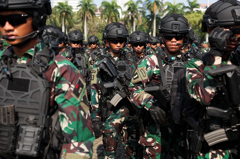 INDONESIA-POLITICS/INAUGURATION An Indonesian Army personnel reacts as he attends a security preparation before the inauguration of President-elect Prabowo Subianto and Vice President-elect Gibran Rakabuming Raka at the National Monument (Monas) in Jakarta, Indonesia, October 18, 2024. REUTERS/Ajeng Dinar Ulfiana TPX IMAGES OF THE DAY