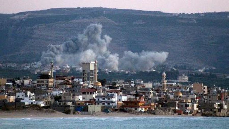 A photo taken from the southern Lebanese city of Tyre shows smoke billowing from the site of an Israeli airstrike that targeted the village of Qlayle on October 23, 2024, amid the ongoing war between Israel and Hezbollah. (Photo by Kawnat HAJU / AFP)